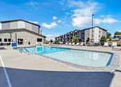 Thumbnail 45 of 81 - A swimming pool in a sunny outdoor setting.