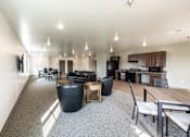 Thumbnail 18 of 19 - a large living room with furniture and a kitchen