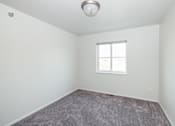 Thumbnail 10 of 19 - an empty room with carpet and a window