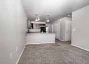 Thumbnail 13 of 26 - A spacious kitchen area with a countertop and cabinets.