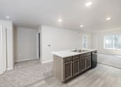 Thumbnail 18 of 26 - A kitchen with a sink and cabinets.