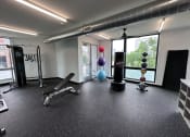 Thumbnail 6 of 81 - Modern gym with rows of cardio equipment.