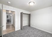 Thumbnail 7 of 22 - A room with a grey carpet and white walls.