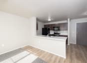 Thumbnail 2 of 22 - A kitchen area with a countertop and cabinets.