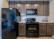 Thumbnail 18 of 29 - Stylish kitchen perfect for cooking and entertaining at White Oak