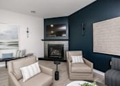 Thumbnail 24 of 33 - a living room with a fireplace and a television