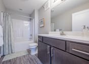 Thumbnail 22 of 29 - Clean and inviting bathroom with plenty of storage at White Oak