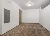 Thumbnail 54 of 59 - A room with a carpeted floor and a door.