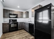Thumbnail 21 of 35 - kitchen with black appliances