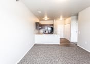 Thumbnail 8 of 17 - living room looking into kitchen