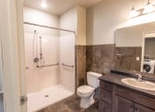 Thumbnail 15 of 24 - bathroom with roll in shower