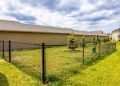 Thumbnail 37 of 37 - Fenced dog park with agility equipment.