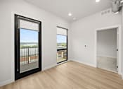 Thumbnail 34 of 42 - A room with a sliding door and a window.