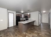 Thumbnail 73 of 81 - A kitchen with a wooden floor and a white ceiling.