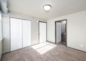 Thumbnail 76 of 81 - A room with a carpeted floor and a white ceiling with a light fixture.