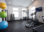 Thumbnail 17 of 21 - Modern gym with rows of cardio equipment.