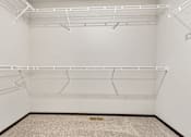 Thumbnail 14 of 43 - Empty room with white walls and shelves.