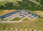 Thumbnail 54 of 55 - an aerial view of a parking lot and a building