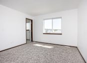 Thumbnail 19 of 54 - an empty room with a window and a door