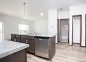 Thumbnail 28 of 54 - a kitchen with a sink and a counter top