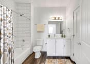 Thumbnail 8 of 17 - a white bathroom with a shower toilet and sink