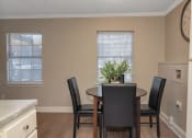 Thumbnail 10 of 19 - an image of a dining room with a table and chairs