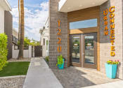 Thumbnail 17 of 23 - the facade of a condo building with the doors open