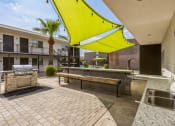 Thumbnail 15 of 23 - the preserve at ballantyne commons community patio with a grill and a picnic table