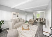 Thumbnail 1 of 22 - a living room with a couch and a rug