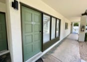Thumbnail 10 of 22 - a green door with the number 102 on it