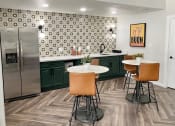 Thumbnail 18 of 22 - a kitchen with green cabinets and a stainless steel refrigerator