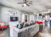 Thumbnail 35 of 37 - a living room with a couch and a ceiling fan at Republic at Alamo Heights, San Antonio Texas