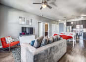 Thumbnail 26 of 37 - a living room with a couch and a ceiling fan at Republic at Alamo Heights, San Antonio, TX
