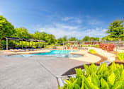 Thumbnail 59 of 72 - a swimming pool with trees in the background and a blue sky at Radius on Grove, Austin