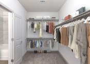 Thumbnail 33 of 65 - a walk in closet with a rack of clothes and a shower at Birdie on Woodland Greens, Texas
