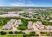 Thumbnail 50 of 72 - an aerial view of a suburb of a city with buildings and trees at Radius on Grove, Austin, Texas