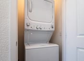 Thumbnail 30 of 41 - A white oven and dishwasher in a small room.