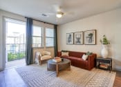 Thumbnail 2 of 65 - an open living room with a couch and a coffee table at Birdie on Woodland Greens, Austin, 78726