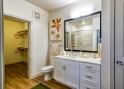 Thumbnail 25 of 65 - a bathroom with a sink and a toilet and a mirror at Birdie on Woodland Greens, Texas 78726