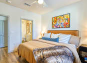 Thumbnail 4 of 65 - a bedroom with a bed and a bathroomat Birdie on Woodland Greens, Texas 78726