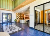Thumbnail 12 of 65 - the lobby or reception area of a house with a large glass door at Birdie on Woodland Greens, Austin, 78726