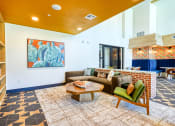 Thumbnail 15 of 65 - a living room with a couch and a coffee table at Birdie on Woodland Greens, Austin