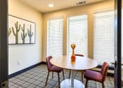 Thumbnail 17 of 65 - a dining room with a table and chairs and windows at Birdie on Woodland Greens, Austin, TX