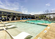 Thumbnail 32 of 39 - Swimming Pool with lounges at The Landings at Brooks City-Base Apartments , TX, 78235