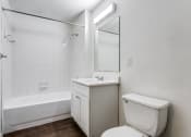 Thumbnail 13 of 13 - a bathroom with a toilet sink and bathtub  at Rosillo Creek Apartments, Texas