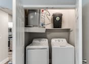 Thumbnail 19 of 36 - A laundry room with a washer and dryer in it at Rosemary Apartments, Conroe, TX