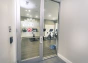 Thumbnail 9 of 37 - a view of the fitness center from the entrance of the building at Republic at Alamo Heights, San Antonio Texas