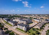 Thumbnail 5 of 22 - Bird's eye view of a residential area with multiple apartment buildings at Kessler, Texas, 76137