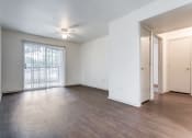 Thumbnail 6 of 13 - a bedroom with hardwood floors and white walls  at Rosillo Creek Apartments, San Antonio, 78218