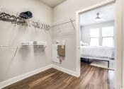 Thumbnail 12 of 27 - a bedroom with a bed and a closet at The Landings at Brooks City-Base, Texas